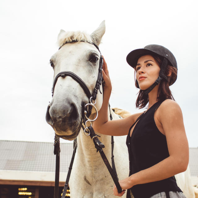 girls learn how to ride horses